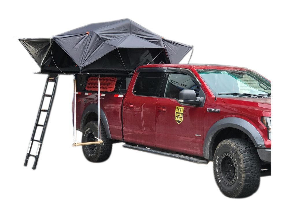 Max roof tent open over the load bay of a red Ford F-150