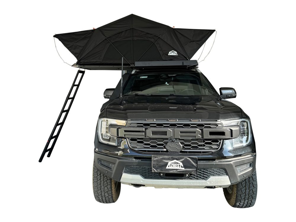 Slim black roof tent open on a Ford Ranger, front view with the ladder down