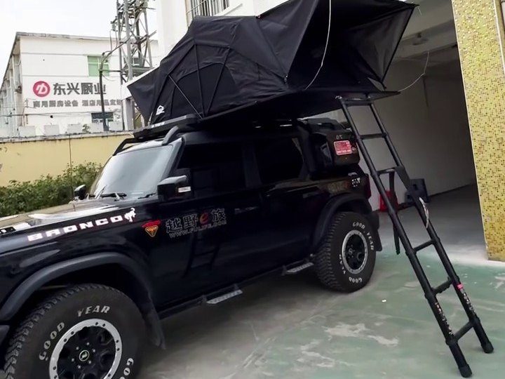 Ford Bronco with the roof tent open and the ladder down