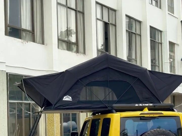 Yellow GWM Tank 300 with the roof tent open
