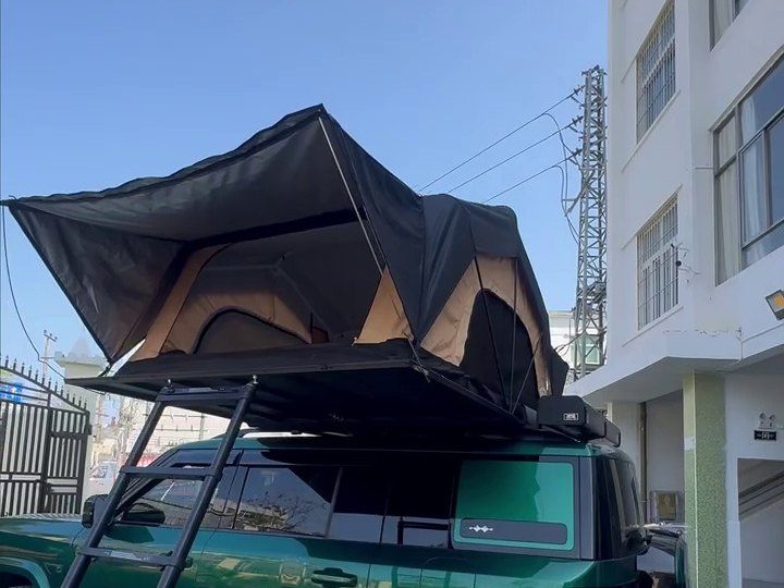 Roof tent open on a green Fangchengbao Titanium 7